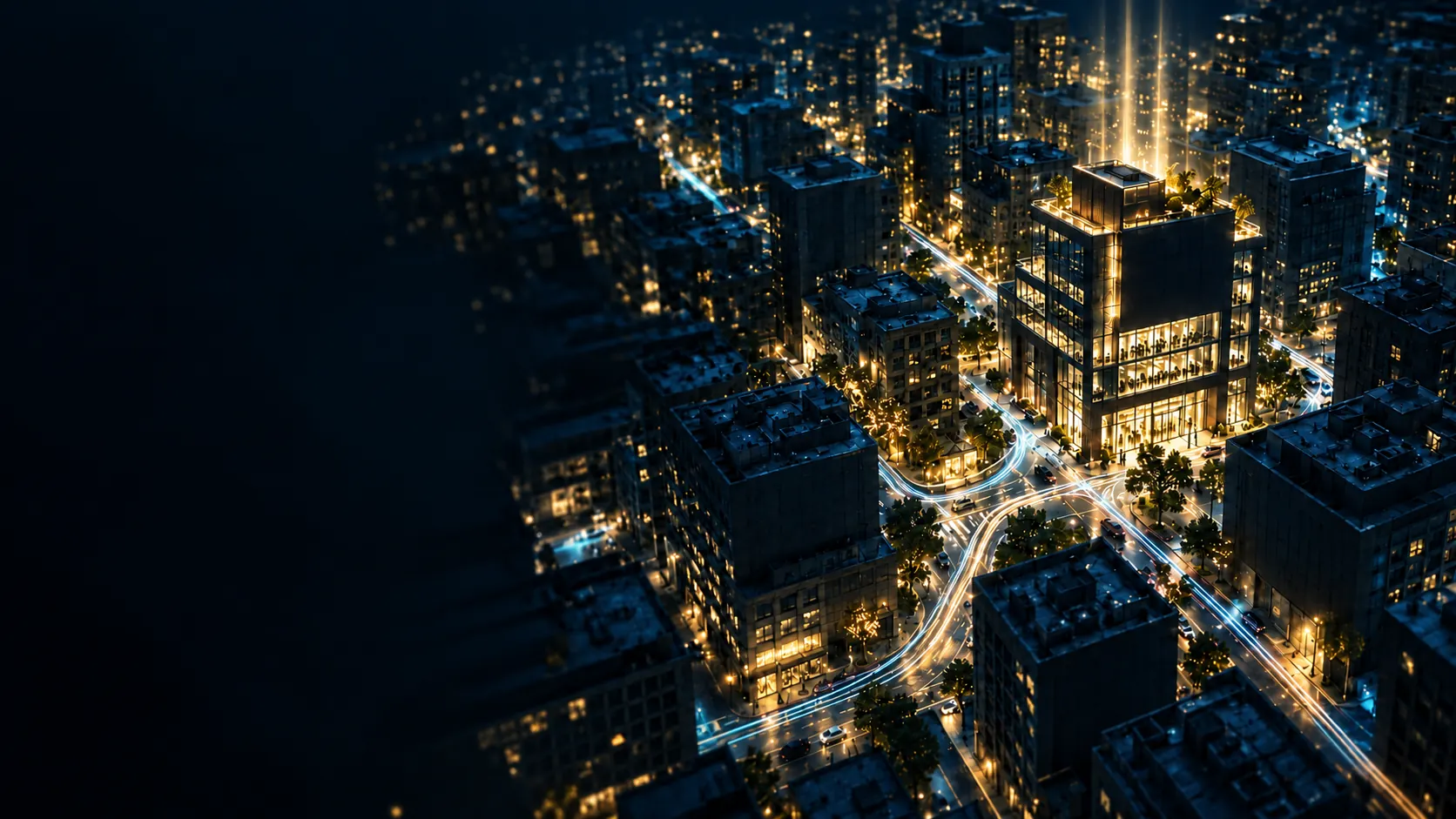 A city at night seen from above, with one building lit up gold among dark blocks